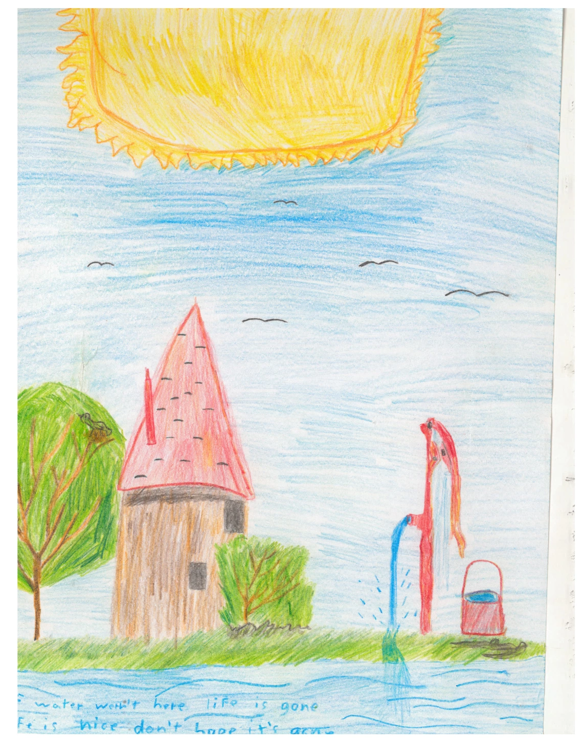 A house is by a river and a water pump flowing with water