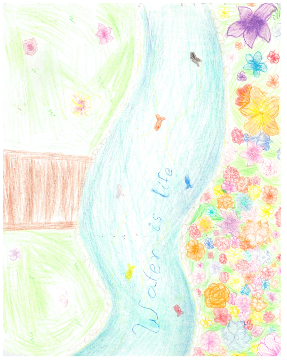 A stream going through a meadow says "Water Is Life!"